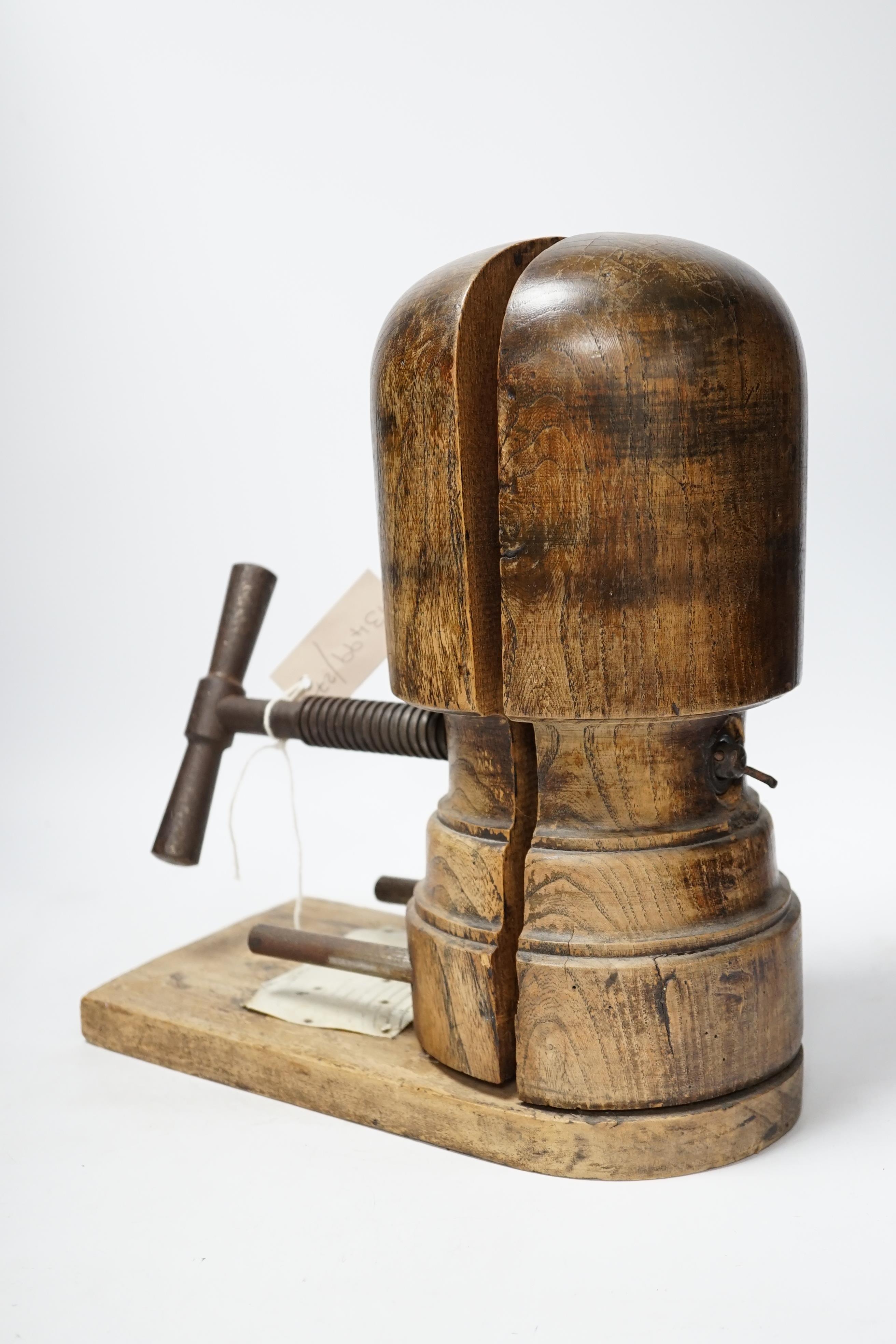 A vintage miliner's hat mould, 35cm high